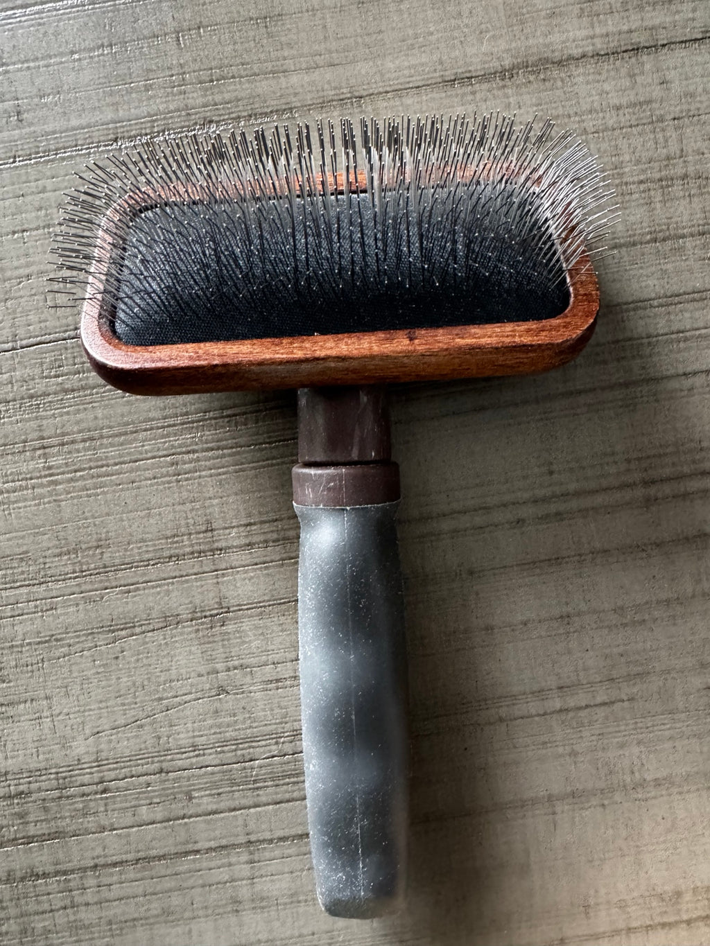 Real Avelie slicker brush showing wood head, black cushion and handle