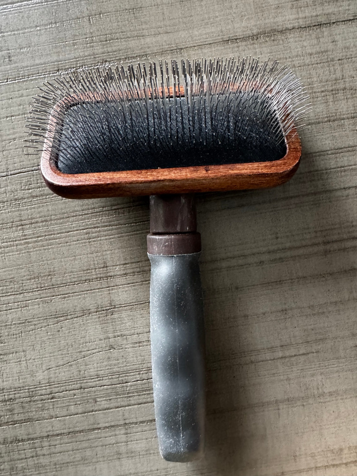 Real Avelie slicker brush showing wood head, black cushion and handle